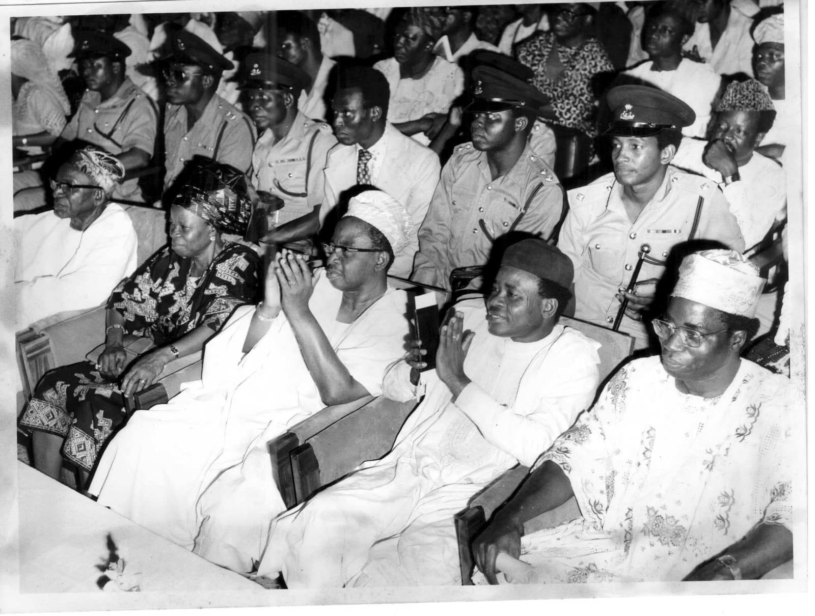 Chief Michael Adekunle Ajasin (centre-left) seated at a state event with dignitaries and police officers in the background, Ondo State, 1979 to 1983.