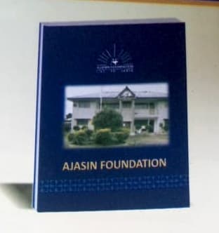 The Ajasin Foundation publication, cover featuring the Foundation's headquarters building in Owo.