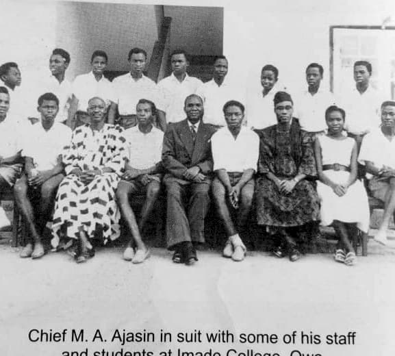 Chief M. A. Ajasin in suit with his staff and students at Imade College, Owo, where he served as founding principal from 1947.
